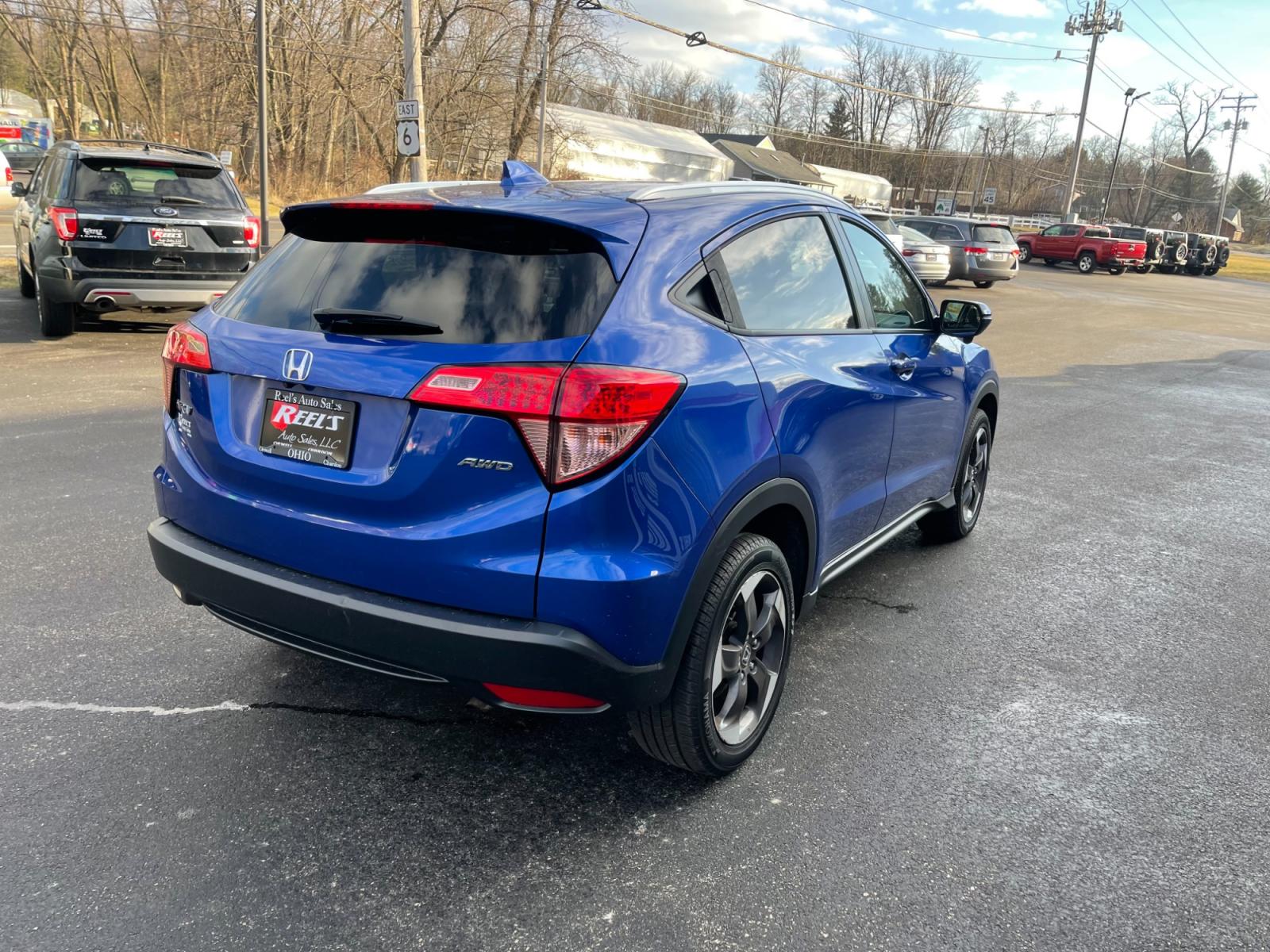 2018 Blue /Black Honda HR-V EX-L w/Navigation 4WD CVT (3CZRU6H71JM) with an 1.8L I4 DOHC 16V engine, Automatic transmission, located at 11115 Chardon Rd. , Chardon, OH, 44024, (440) 214-9705, 41.580246, -81.241943 - This 2018 Honda HR-V equipped with AWD (All Wheel Drive) and a 1.8L engine paired with a CVT (Continuously Variable Transmission) offers a blend of performance and efficiency. Its luxurious leather interior, complemented by heated seats and an automatic climate control system, ensures a comfortable - Photo #7